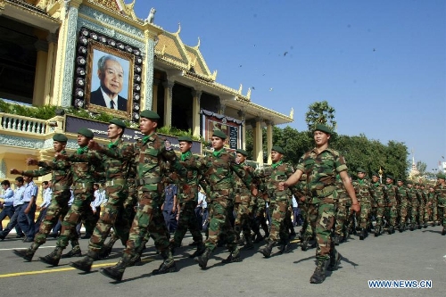  Cambodian troops march in front of the Royal Palace in preparation for the funeral of late King Father Norodom Sihanouk in Phnom Penh, Cambodia, Jan. 19, 2013. Sihanouk died of illness at the age of 90 in Beijing on Oct. 15, 2012. His body will be moved to a custom-built crematorium at the Meru field next to the Royal Palace on Feb. 1 and kept it for another three days at the site before it is cremated on Feb. 4. (Xinhua/Sovannara) 