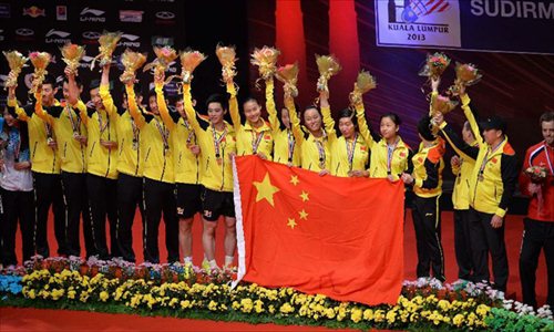 Players of China celebrate during the awarding ceremony after the final match against South Korea at the Sudirman Cup World Team Badminton Championships in Kuala Lumpur, Malaysia, on May 26, 2013. Team China won the champion with 3-0. Photo: Xinhua