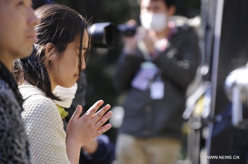 &nbsp;People attend a mourning ceremony in Tokyo, capital of Japan, on March 11, 2013. A mourning ceremony was held here Monday to mark the two year anniversary of the March 11 earthquke and ensuing tsunami that left more than 19,000 people dead or missing and triggered a nuclear accident the world had never seen since 1986. (Xinhua/Kenichiro Seki) 