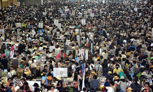 Thousands of fans attend the Summer Comic Market on Saturday in Tokyo, Japan. Despite the scorching heat, enthusiasm, exhilaration and exuberance were in the air on the opening day of the Summer Comic Market. About 210,000 comic buffs visited the three-day biannual trade fair for comics and animation. Photo: CFP