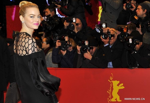 Actress Emma Stone poses on the red carpet for the screening of the film 