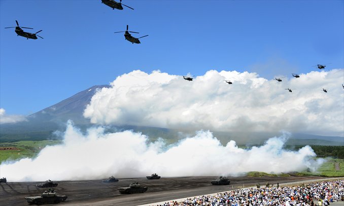 Tanks and helicopters from Japan's Ground Self-Defense Forces join in an annual military exercise in Gotemba, at the foot of Mt. Fuji in Shizuoka prefecture on Tuesday. The annual drill involves some 2,400 personnel, 80 tanks and armored vehicles and 30 aircraft and helicopters. Earlier reports said a US-Japan drill will take place near Tinian Island in the western Pacific. Photo: AFP