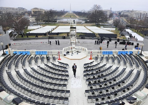 A staff checks the venue during a dress rehearsal of the 57th Presidential Inaugural ceremony on the West Steps of the U.S. Capitol in Washington D.C., capital of the United States, Jan. 13, 2013. U.S. President Barack Obama will be ceremonially sworn in for a second four-year term on January 21. (Xinhua/Zhang Jun) 