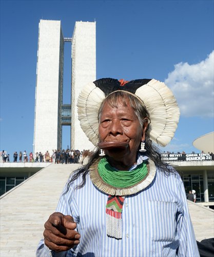 Chief Raoni of the Kayapo indigenous group attends a protest in front of the National Congress in Brasilia on Tuesday. The 84-year-old leader is famed for his battles to protect the Amazon rain forest. Around 500 indigenous chiefs, many from the Amazon basin, attended the protest.