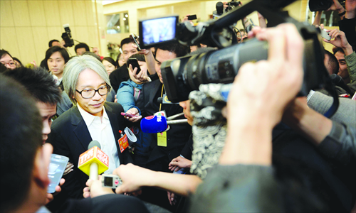Hong Kong actor Stephen Chow, also a member of the Guangdong CPPCC provincial committee, is surrounded by journalists after the opening session of the Guangdong People's Congress in Guangzhou, on January 25. Photo: IC 