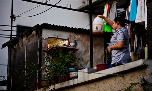 A small pigeon loft on the balcony of an apartment on Yan'an Road, Jing'an district. Photo: Cai Xianmin/GT