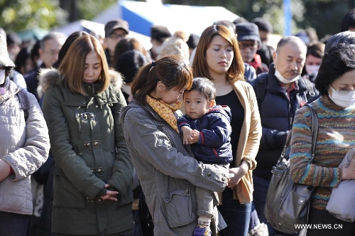 &nbsp;People attend a mourning ceremony in Tokyo, capital of Japan, on March 11, 2013. A mourning ceremony was held here Monday to mark the two year anniversary of the March 11 earthquke and ensuing tsunami that left more than 19,000 people dead or missing and triggered a nuclear accident the world had never seen since 1986. (Xinhua/Kenichiro Seki) 
