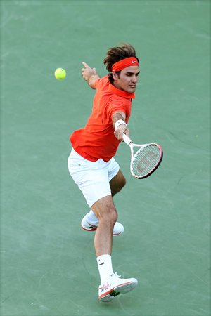 Roger Federer hits a return to Stanislas Wawrinka during day eight of the BNP Paribas Open on Wednesday. Photo: AFP