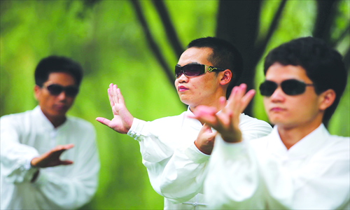 Blind students practice Tai Chi every morning at Master Wan's training center in Beijing. Photo: IC