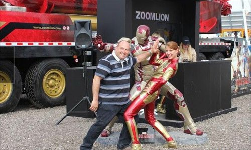 People wear Iron Man outfits at a Zoomlion event.