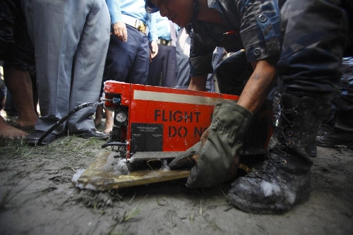The black box of the crashed Sita Air plane is taken for investigation in Kathmandu, Nepal, Sept. 28, 2012. Nineteen people including three crew members were killed after the Dornier Aircraft 9N-AHA of Sita Air crashed just a kilometer far from the Tribhuvan International Airport (TIA) in Kathmandu. (Xinhua/Sunil Sharma)
