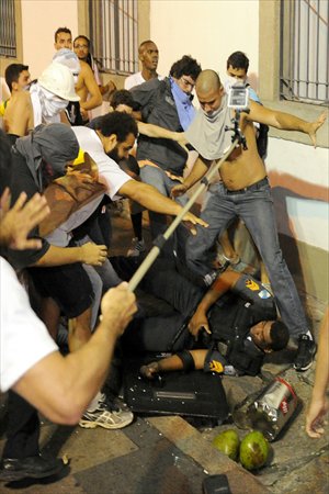 Demonstrators clash with riot police during a protest, the biggest one in 20 years, in front of Rio de Janeiro's Legislative Assembly building on Monday. Tens of thousands of people took to the streets of major Brazilian cities protesting the billions of dollars spent on the Confederations Cup - and preparations for the upcoming World Cup - and against the hike in mass transit fares. Photo: AFP