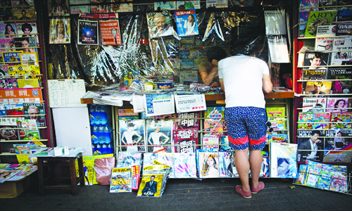 A person looks at magazines at a newsstand in Shanghai earlier this month. Photo: CFP