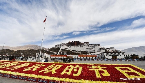 A flag-raising ceremony is held in front of the Potala Palace to mark the 54th anniversary of the abolishment of Tibet's feudal serfdom in Lhasa, capital of southwest China's Tibet Autonomous Region, March 28, 2013. Authorities have designated March 28 as the day to commemorate the 1959 democratic reform in Tibet, which ended the feudal serf system. The reform freed about 1 million Tibetans, over 90 percent of the region's population at the time, from a life of serfdom. (Xinhua/Purbu Zhaxi) 