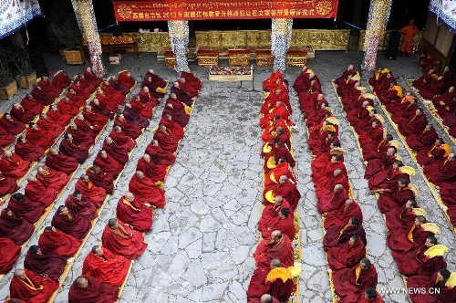 Monks are present at the awarding ceremony for Gexe Lharampa, the highest academic degree in Tibetan Buddhism studies, at the Jokhang Temple in Lhasa, capital of southwest China's Tibet Autonomous Region, April 5, 2013. Eight laureates of Gexe Lharampa were awarded here on Friday after they passed tests and defended their dissertations. Gexe means knowledgeable and Lharampa is the highest among the four ranks in the Gexe system. (Xinhua/Chogo)&nbsp; 