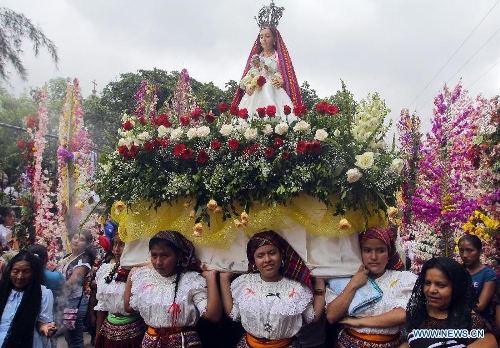 Residents participate in the procession of 