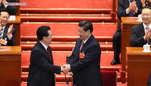 Hu Jintao (L) congratulates Xi Jinping at the fourth plenary meeting of the first session of the 12th National People's Congress (NPC) in Beijing, capital of China, March 14, 2013. Xi was elected president of the People's Republic of China (PRC) and chairman of the Central Military Commission of the PRC at the NPC session here on Thursday. (Xinhua/Ding Lin)
