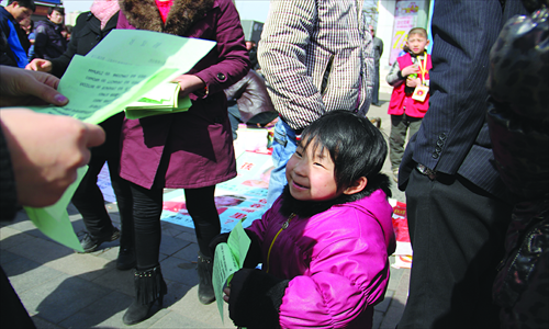 Handing out fliers in search of a kidnapped brother. Photo: Courtesy of Charlie Custer 