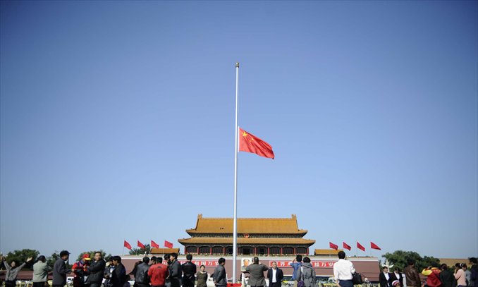 The national flag at Tian'anmen Square is flown at half-mast Wednesday in Beijing as a sign of respect for the passing of Cambodia's former King Norodom Sihanouk. Photo: Li Hao/GT