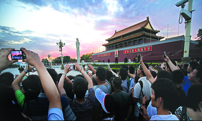 Crowds gather to watch the flag-lowering ceremony at Tiananmen Square in Beijing on July 1, the day that marks the founding of the Communist Party of China. Photo: CFP