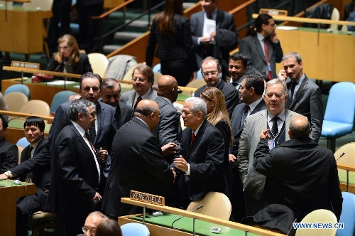 Venezuelan ambassador to the United Nations Jorge Valero receives condolences during a tribute to the memory of late Venezuelan President Hugo Chavez, at the UN headquarters in New York, on March 13, 2013. UN officials paid tribute to Chavez on Wednesday. (Xinhua/Niu Xiaolei) &nbsp;