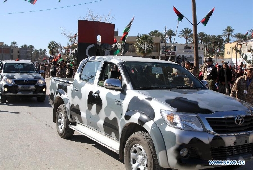 Libyan soldiers demonstrate their skills during a celebration for the second anniversary of the uprising that toppled the regime of strongman Muammar Gaddafi in the Tajoura area in the Libyan capital Tripoli, on Feb. 17, 2013. (Xinhua/Hamza Turkia) 