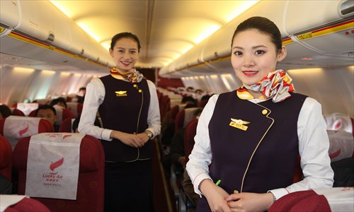 Although cases where flight attendants have been verbally or physically abused have been well publicized, the profession remains very popular for young people. Photo: CFP