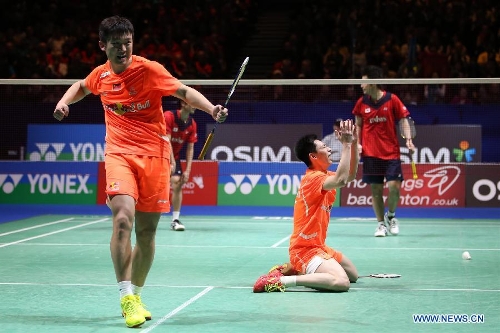 China's Liu Xiaolong (front, R) and Qiu Zihan (L) celebrate after winning the men's doubles final against Japan's Hiroyuki Endo/Kenichi Hayakawa at the All England Open Badminton Championships in Birmingham, Britain, March 10, 2013. The Chinese pair won 2-0 to claim the title of the event.(Xinhua/Tang Shi) 
