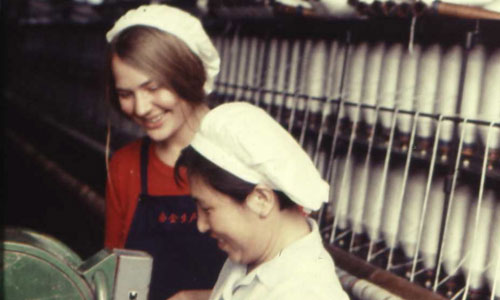 Isabel stands with a cotton factory worker in Shanghai, 1974. Photo: Courtesy of Isabel Hilton 

