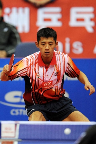 China's Zhang Jike of Team Asia returns the ball during the match against Germany' Dimitrij Ovtcharov of Team Europe at the 2013 Asia-Europe Table Tennis All Stars Challenge in Qingdao, east China's Shandong Province, March 17, 2013. Team Asia won 7-3. (Xinhua/Li Ziheng) 