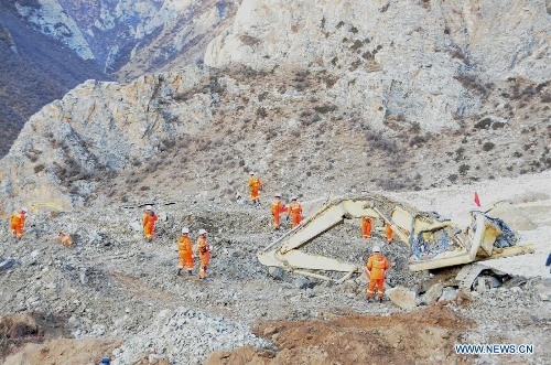 Rescuers work at the accident site after a major landslide hit a mining area of Tibet Huatailong Mining Development Co. Ltd, a subsidiary of the China National Gold Group Corporation, in Maizhokunggar County of Lhasa, capital of southwest China's Tibet Autonomous Region, March 30, 2013. A total of 83 workers were buried in the landslide, which happened on Friday morning. Rescuers have not yet found survivors or bodies 28 hours after the massive landslide. (Xinhua/Zhang Quan) 