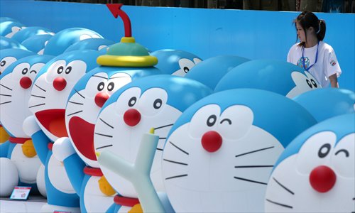 Doraemons with their special gadgets display along the sidewalk. Photo: Cai Xianmin/GT