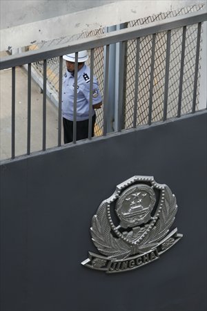 A police officer stands inside the Shijiazhuang Re-education through Labor Center in May, 2012. Photos: CFP