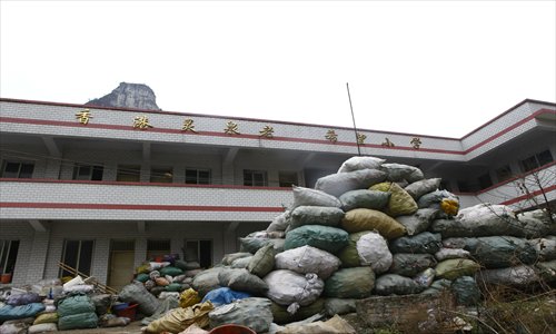 The abandoned Lingchuan Laoshan Hope Primary School in Kaili, Guizhou Province, is currenty being used as a garbage dump. Photo: Courtesy of Zhang Jiaofeng, media officer from the China Youth Development Foundation