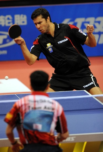 Belarus' Vladimir Samsonov of Team Europe returns the ball during the match against Chinese Taipei's Chuan Chih-Yuan of Team Asia at the 2013 Asia-Europe Table Tennis All Stars Challenge in Qingdao, east China's Shandong Province, March 17, 2013. Team Asia won 7-3. (Xinhua/Li Ziheng) 