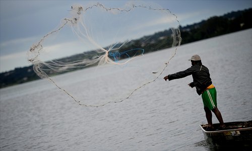 A fisherman casts his net of Friday into Paranoa Lake in Brasilia, Brazil. World Water Day, celebrated on March 22 each year, aims to raise international awareness about preservation of drinking water resources. The UN estimates 780 million people worldwide lack access to clean water, while 2.5 billion do not have access to adequate sanitation. Photo: AFP