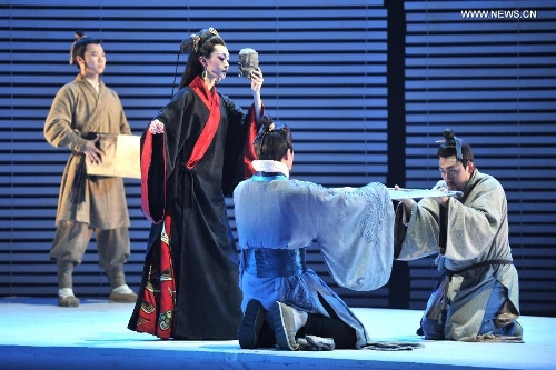 Actors Song Yi (2nd L) from Beijing People's Art Theater plays drama 