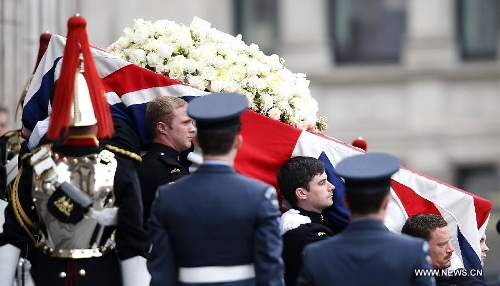 The coffin of British former prime minister Margaret Thatcher is carried out of St. Paul's Cathedral following the ceremonial funeral service in London, Britain, April 17, 2013. The funeral of Margaret Thatcher, the first female British prime minister, started 11 a.m. local time on Wednesday in London. (Xinhua/Wang Lili)