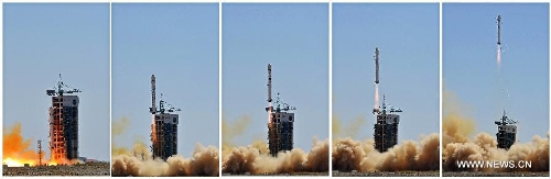 Combination photo taken on April 26, 2013 shows a Long March-2D carrier rocket carrying a high-definition earth observation satellite 