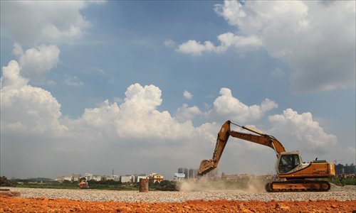 An excavator works on July 19 at the site in Changsha, Hunan Province where an ambitious Sky City, aiming to be the world's tallest tower, is to break ground. Photo: IC