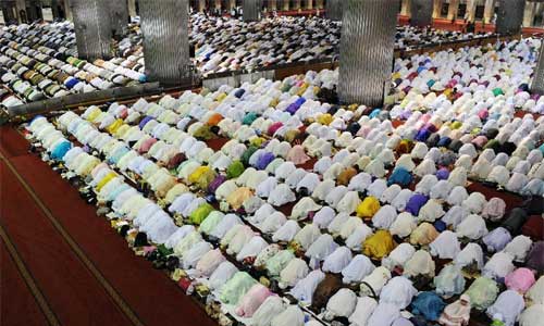 Indonesian muslims offer the evening prayer 