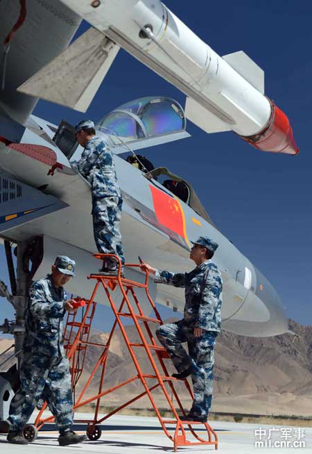 Maintenance engineers with China's Air Force were checking the J-11 fighters before their flights at an airport in Tibet on May 19. 
