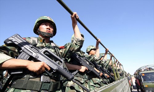 Armed police in Hami, Xinjiang Uyghur Autonomous Region attend an anti-terrorism drill in July this year. Photo: CFP
