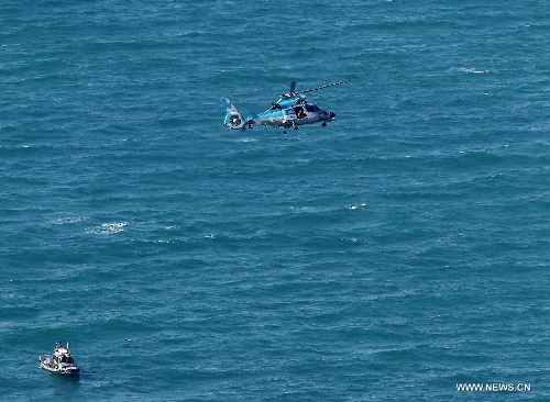 An Israeli air force helicopter operates next to a cruise ship off the coast of Haifa, northern Israel, Thursday, April 25, 2013. An Israeli Air Force F-16 fighter jet downed a drone off the coastline of the northern city of Haifa at noon of Thursday, the Israeli Defense Forces (IDF) said. (Xinhua/Jini)