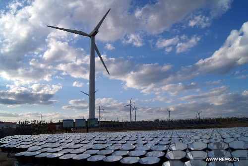 File photo taken on June 12, 2012 shows a scene of the Xiaowutai Photovoltaic Plant in Youyu County, north China's Shanxi Province. According to the latest data released by the State Energy Administration, China has become the world's largest energy producer by the end of 2012. The total installed electricity capacity was 1.14 billion kilowatts, including 249 million of hydropower capacity which was the world's largest. The installed wind power capacity stood at 63 million kilowatts, making China the world's No. 1 in this field. The nuclear power under construction is also the world's largest. (Xinhua/Yan Yan)&nbsp; 