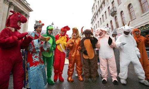 People wearing costumes of Chinese horoscope animals and traditional Chinese styles pose during a parade celebrating the Chinese Lunar New Year in London, Britain, on Feb. 10, 2013. Photo: Xinhua