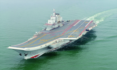 China’s first aircraft carrier was delivered and commissioned to the People’s Liberation Army Navy Tuesday. Photo: Xinhua