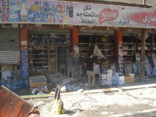 Iraqi people inspect a store destroyed by a car bomb attack at Karada district in Baghdad, Iraq, March 19, 2013. At least 48 people were killed and 167 others wounded in a series of bombings and shootings in the Iraqi capital of Baghdad on Tuesday, an Interior Ministry source said. (Xinhua/Bashar)Related:At least 48 killed, 167 wounded in bombings in BaghdadBAGHDAD, March 19 (Xinhua) -- At least 48 people were killed and 167 others wounded in a series of bombings and shootings in the Iraqi capital of Baghdad on Tuesday, an Interior Ministry source told Xinhua.Several massive explosions, including at least 12 car bombs, ripped through crowded areas mainly in Shiite districts across the capital during the morning rush hours, the source said. Full story