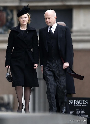 British Foreign Secretary William Hague (R) and his wife Ffion Jenkins arrive for the funeral of former British Prime Minister Margaret Thatcher, outside St. Paul's Cathedral in London, Britain on April 17, 2013. The funeral of Margaret Thatcher, the first female British prime minister, started 11 a.m. local time on Wednesday in London. (Xinhua/Wang Lili)