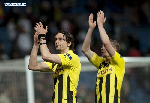 Borussian Dortmund's players celebrate after the UEFA Champions League semi-final against Real Madrid in Madrid, capital of Spain, April 30, 2013. Borussia Dortmund qualified for the Champions League final, beating Real Madrid 4-3 on aggregate despite a 2-0 loss Tuesday. (Xinhua/Xie Haining) 